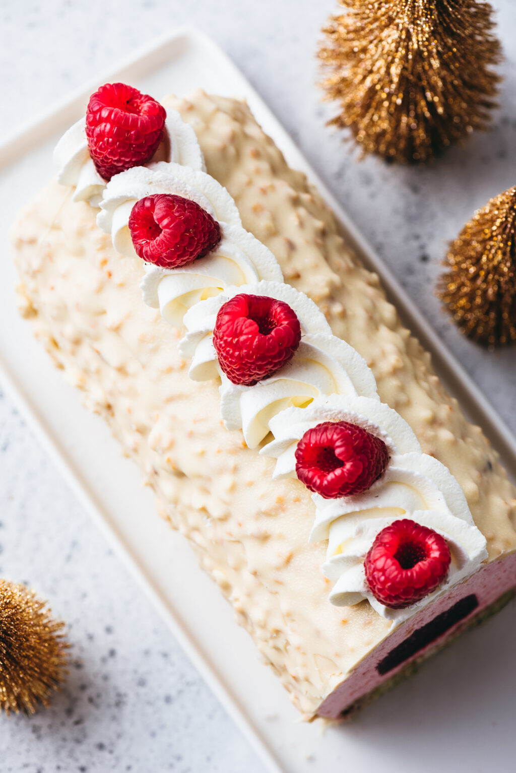 Yule log with white chocolate rock icing - Lilie Bakery